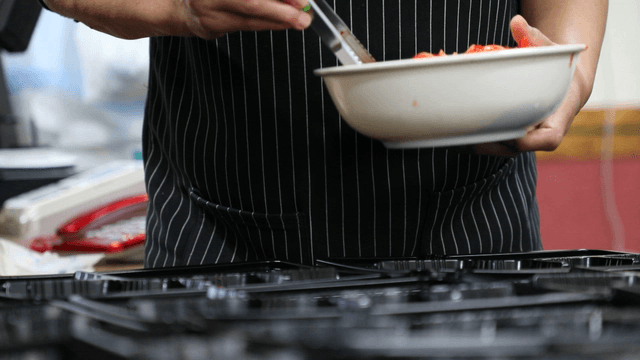 Preparing food in a kitchen with utensils