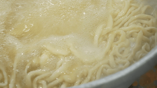 Noodles boiling in a pot