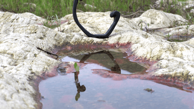 Wooden sculpture above small pool in rocky terrain