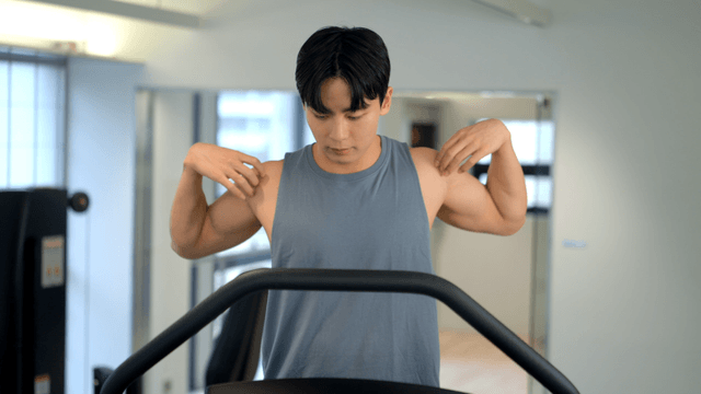 Man jogging on a treadmill at gym