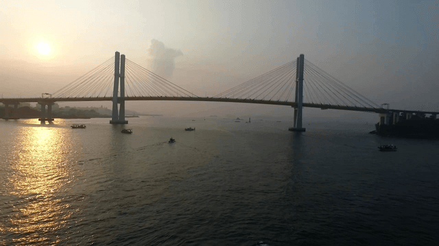 Bridge over the golden sea at sunset
