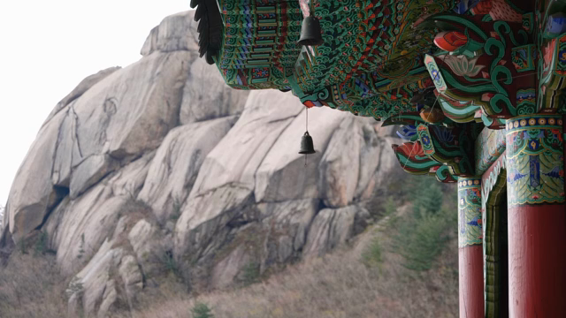 Traditional Korean temple with mountain view