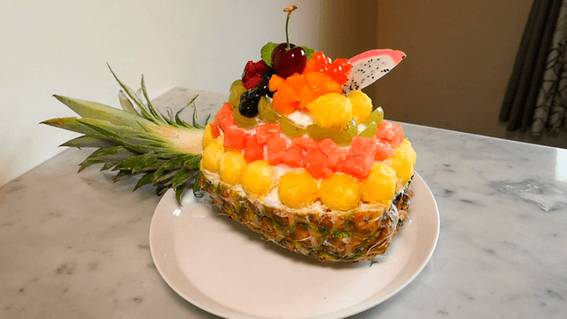 Shaved ice topped with assorted fruits