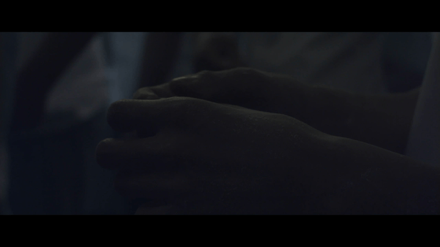 Hand covered with white powder in dark room