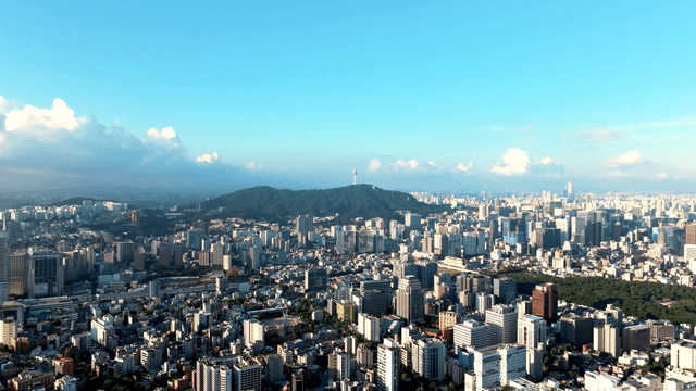 Sprawling cityscape with distant mountains