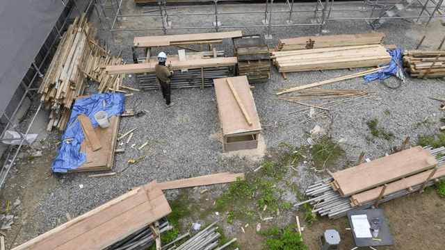 Worker using a hammer on a construction site