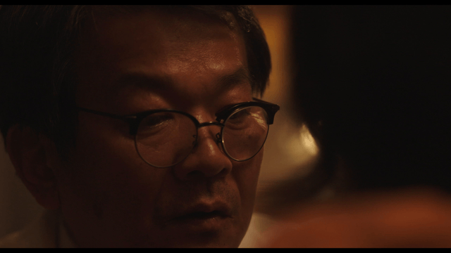 Man wearing glasses concentrating