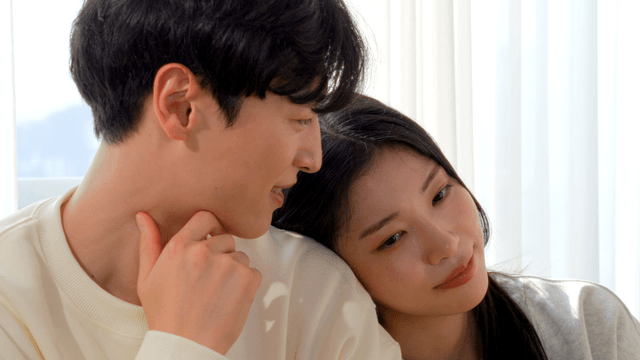 Couple resting by bright window