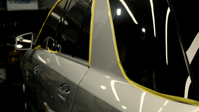 Car with masking tape applied