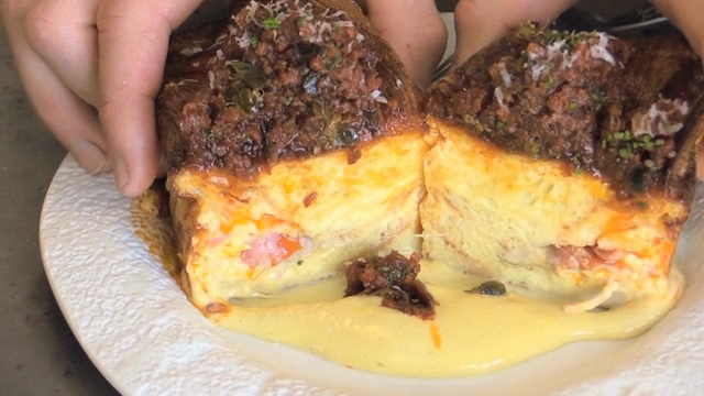 A croissant filled with savory ingredients