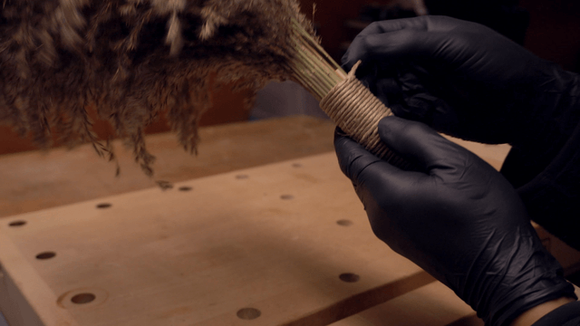 Crafting a handmade broom indoors