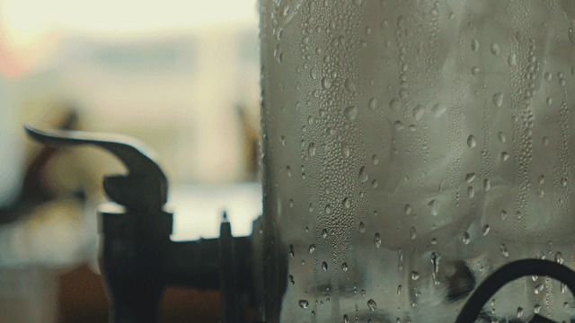 Water droplets on a glass dispenser