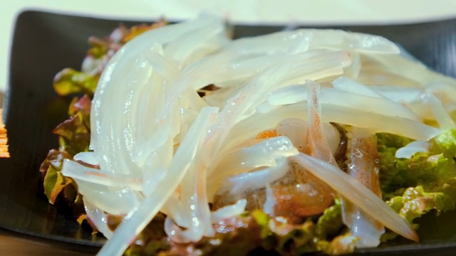 Freshly prepared squid sashimi on a plate