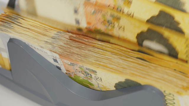 Money being counted in a machine