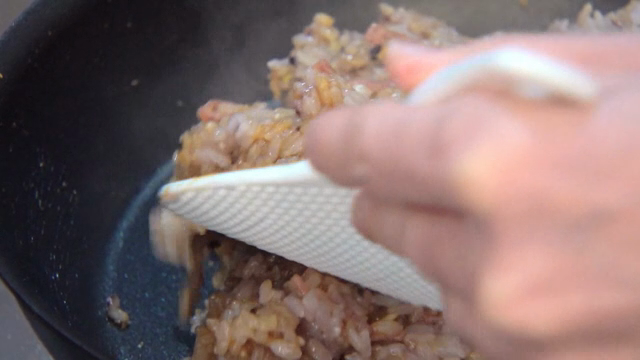 Mixing rice with various ingredients