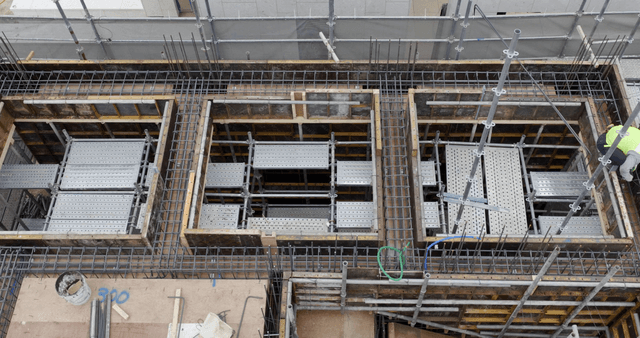 Construction site with workers and materials