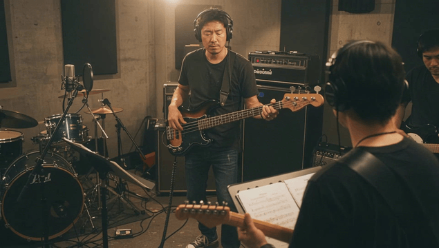 Rock band recording in studio