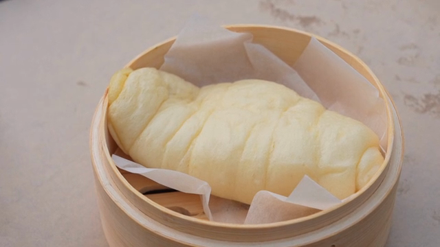 Steamed bread in a bamboo steamer