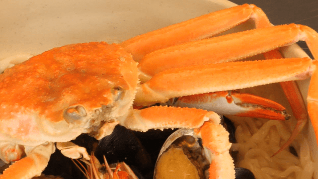 Crab and seafood in a noodle soup