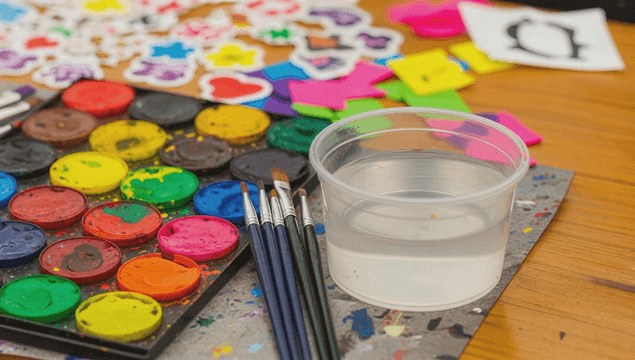 Colorful paint palette and brushes