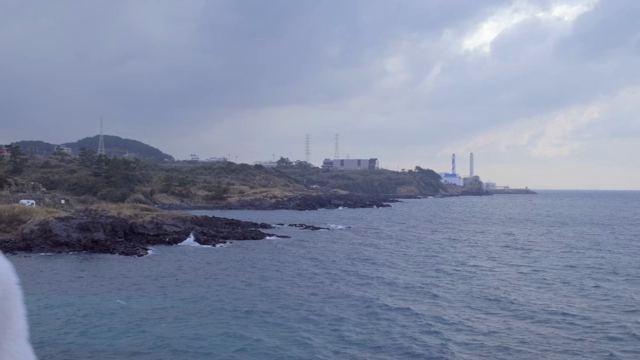 Coastal view with industrial buildings