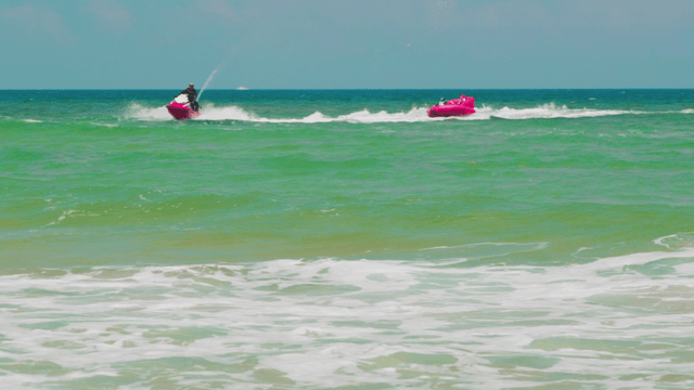 People enjoying jet ski on the sea