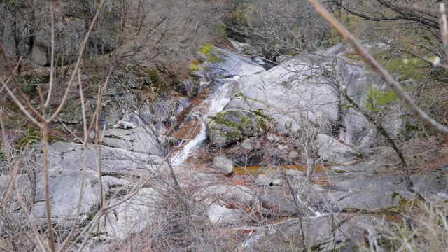 A small waterfall flowing over rocks