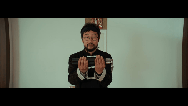 Man holding nunchucks