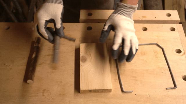 Woodcraft artisan arranging wooden materials in workshop