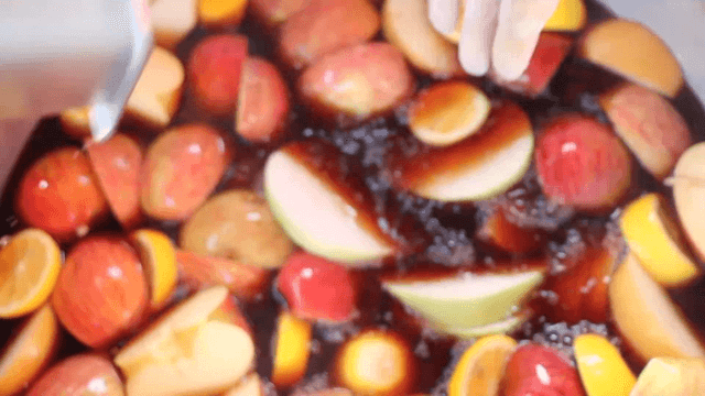 Adding fruit to a pot with soy sauce