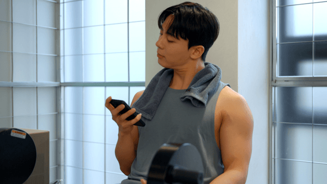 Man checking phone after workout