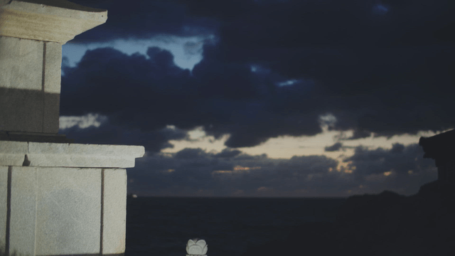 Traditional Korean pagoda under night clouds facing the sea