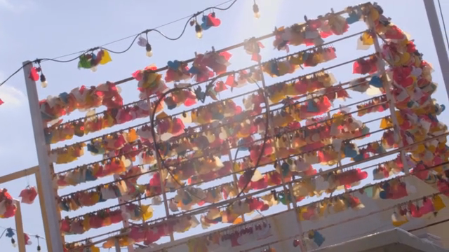 Colorful love locks hanging on a fence