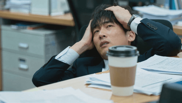 Office worker stressed with documents
