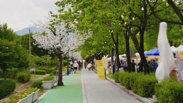 Local festival along a tree-lined walkway
