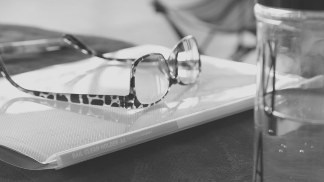 Glasses resting on a document folder