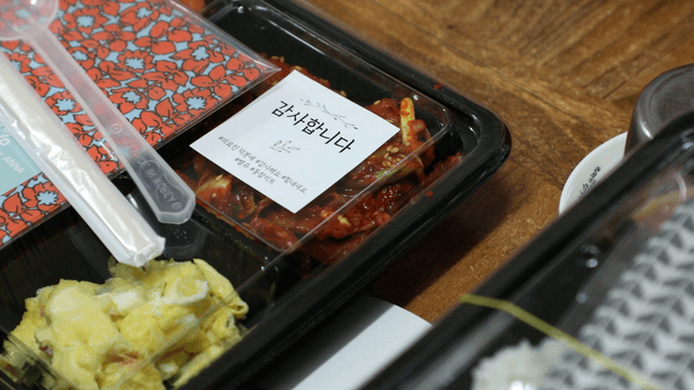 Korean food in a takeout container