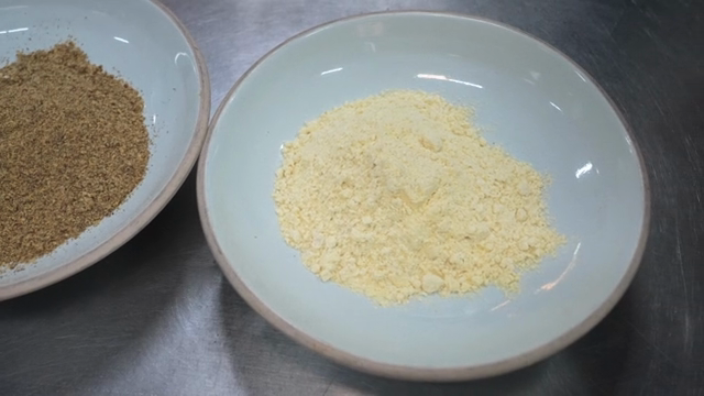 Two bowls with different powders on a table