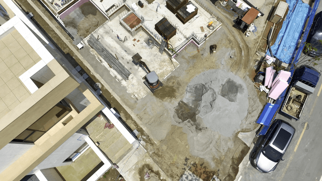 Construction site with excavator in action