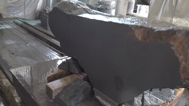 Large basalt block in a stone cutting factory