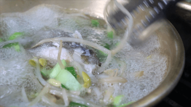 Cod soup boiling with bean sprouts