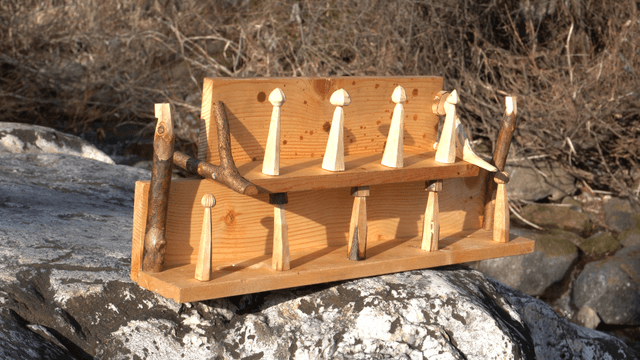 Wooden shelf on a giant rock before the valley