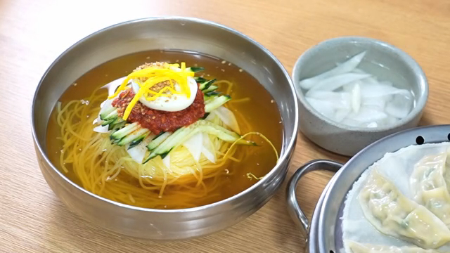 Korean Cold Buckwheat Noodles and dumplings on a table