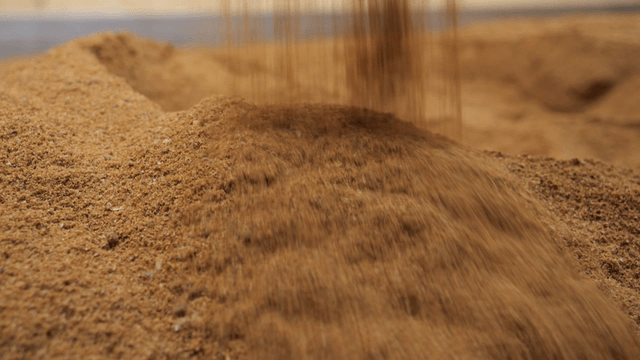 Brown soil piled inside storage room