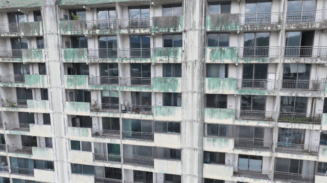 Old apartment building with peeling paint