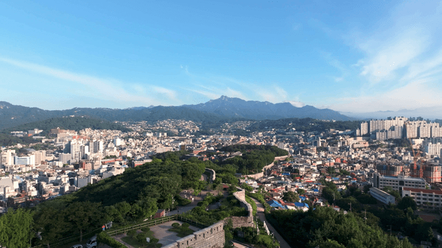 Sprawling cityscape with distant mountains
