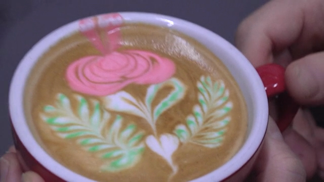 Latte art with colorful floral design