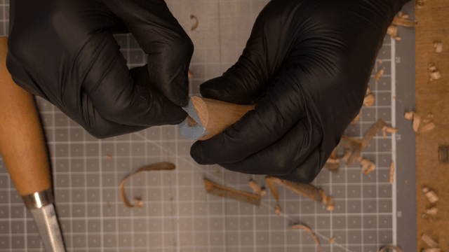 Artisan’s hand sketching positions quickly with a pencil