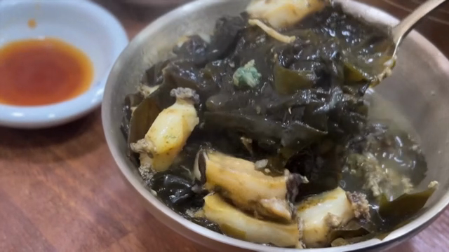 Abalone seaweed soup in a metal bowl