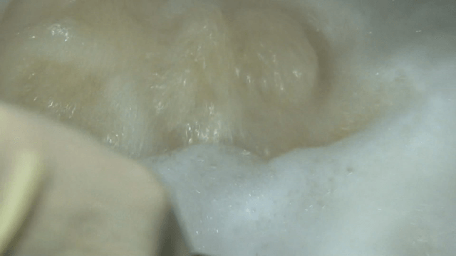 Noodles being stirred in boiling water